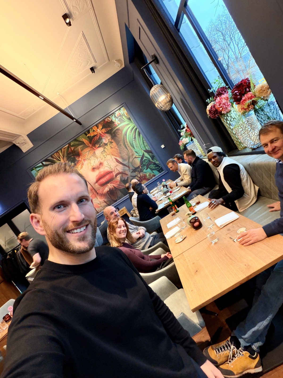 Networking dinner selfie with team and guests